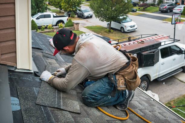 Professional Storm Damage Roof Repair technician working in West Mystic, CT